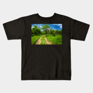 Rural road through meadow Kids T-Shirt